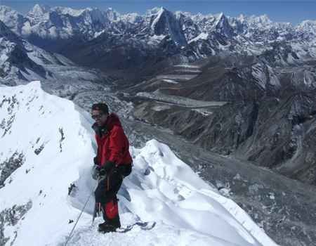 climber on the summit of island peak with the blue sky in the best season spring