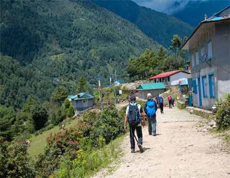 trekkers are on the way from lukla to phakding during the everest base camp trek