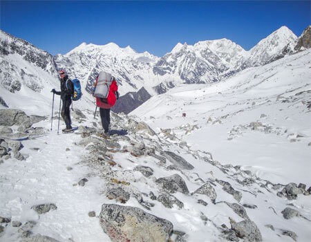 trekkers are descending from larke pass while completing total distance of the Manaslu Circuit Trek.