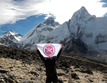 trekkers celebrating successful kalapatthar climb and magnificent view of mount everest