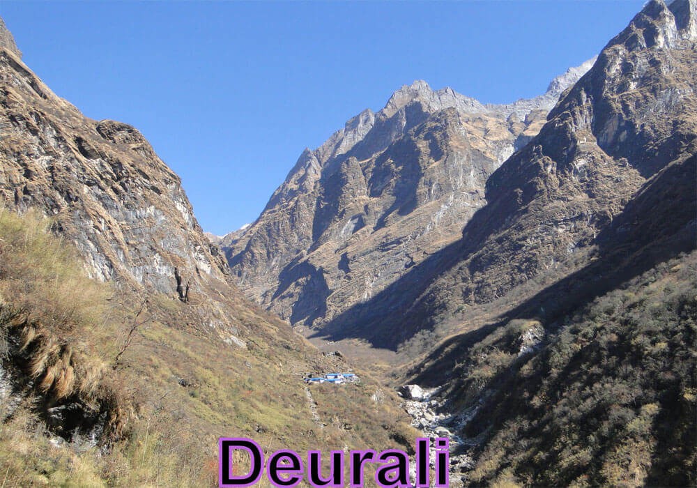 deurali a campsite on the annapurna base camp trekking route, black rocky mountains nearby