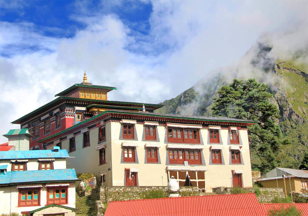 tengboche monastery, blue sky and pine trees around the hill