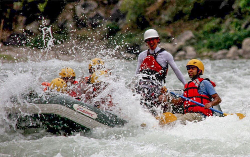 people on a raft in bhotekoshi river during the bhotekoshi river rafting.