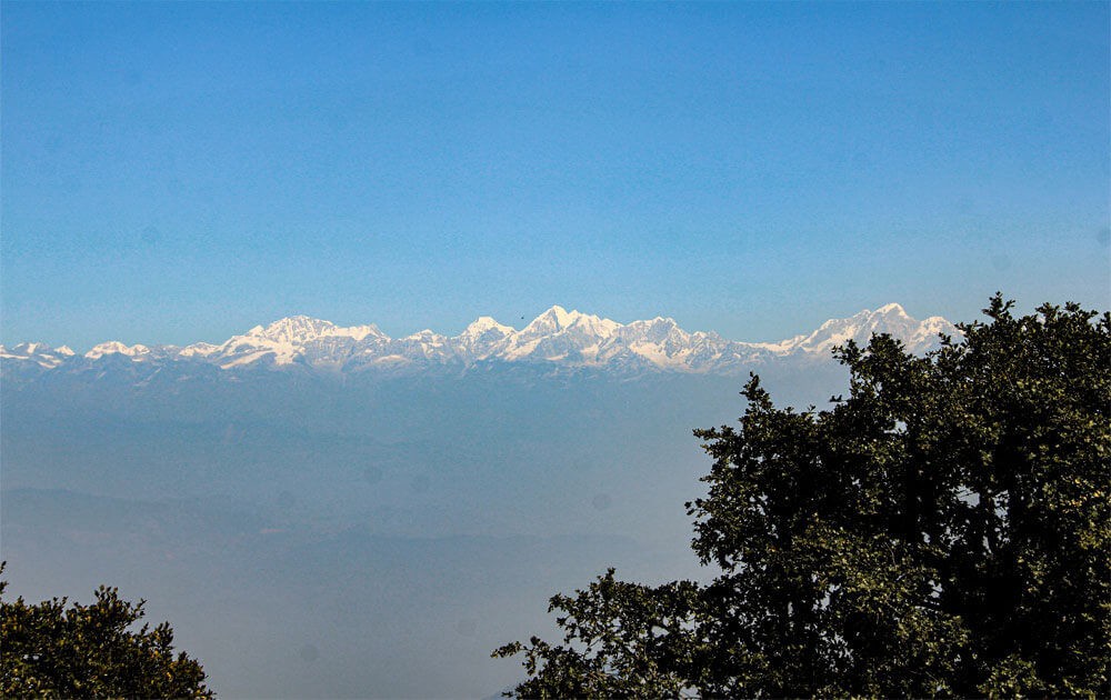 Mountain views and blue sky on a clear day from Chandragiri to Champadevi hiking trail.