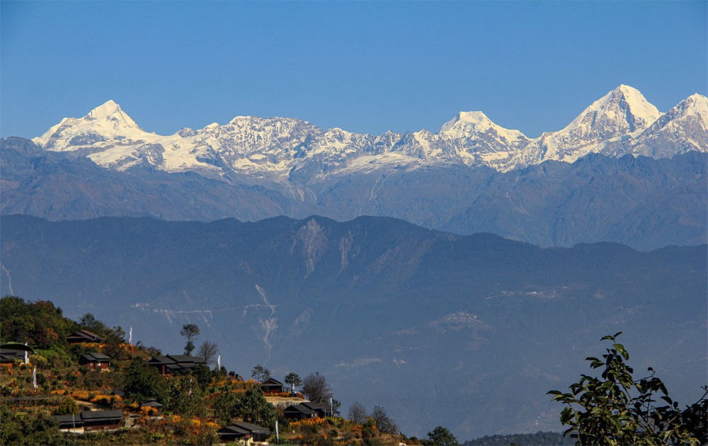 langtang himalayan views from chisapani nagarkot trekking trail with blue sky on a clear day.