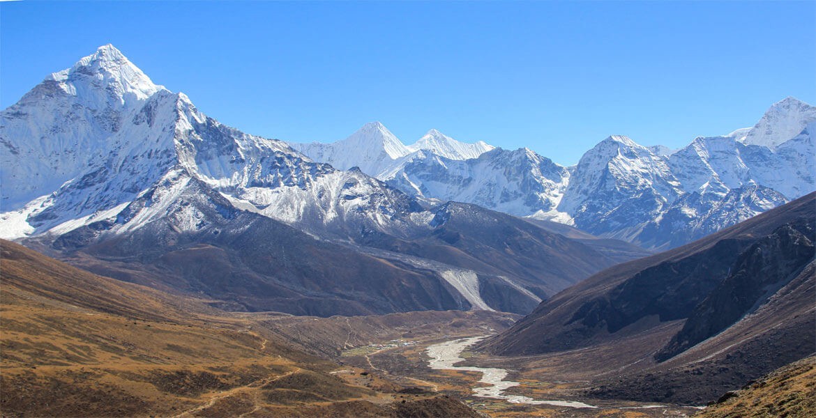 everest himalayas and pheriche valley during clockwise or counter-clockwise cho la pass trek in a clear day with blue sky.