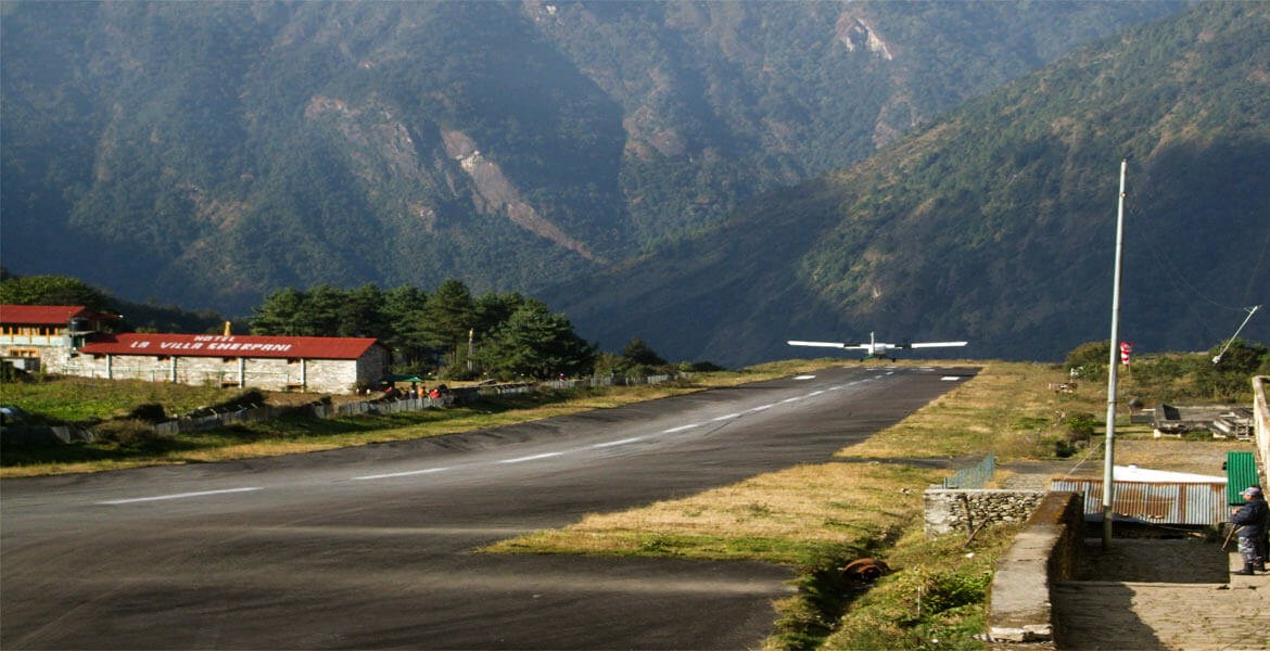 a plane is flying after taking off from lukla airport to kathmandu