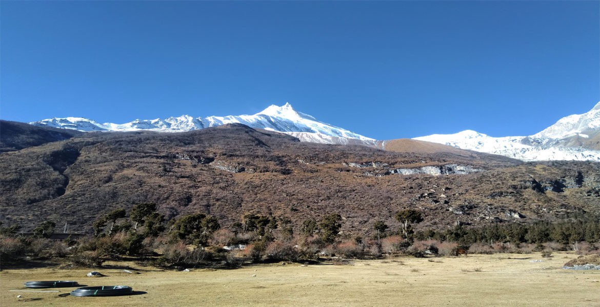 mt. manaslu, blue sky from samagaun in september in a clear weather