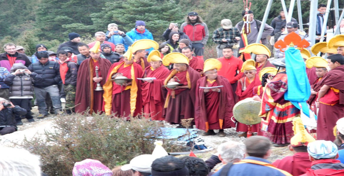 monks and locals celebrating mani rimdu festival in tengboche