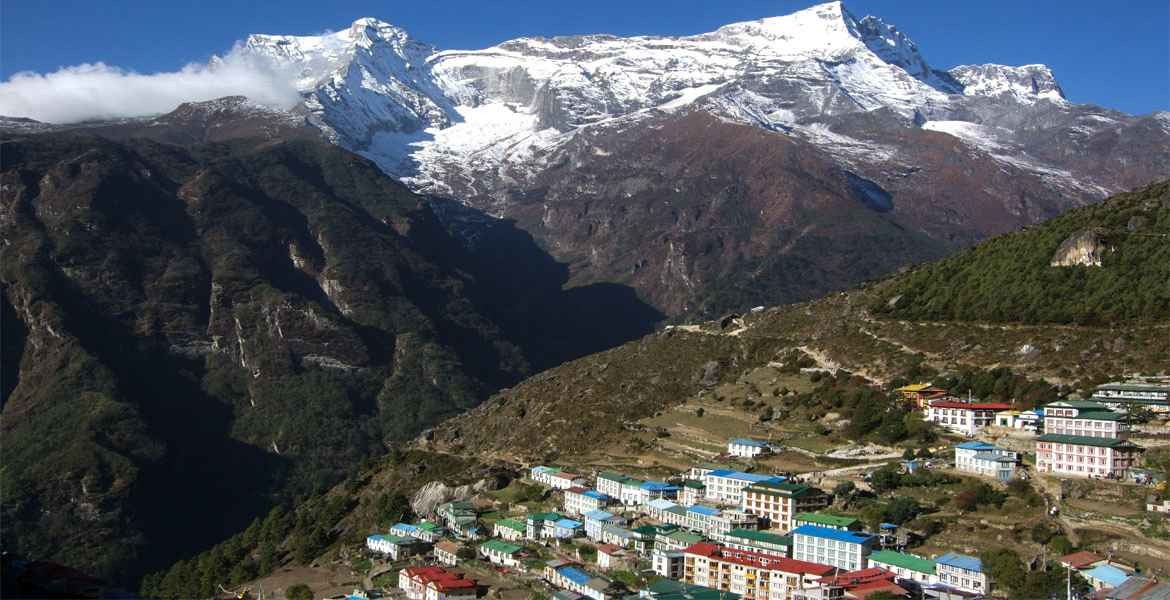 Namche Bazaar and Mt.Kongde view with the blue sky after walking from Phakding to Namche Bazaar.