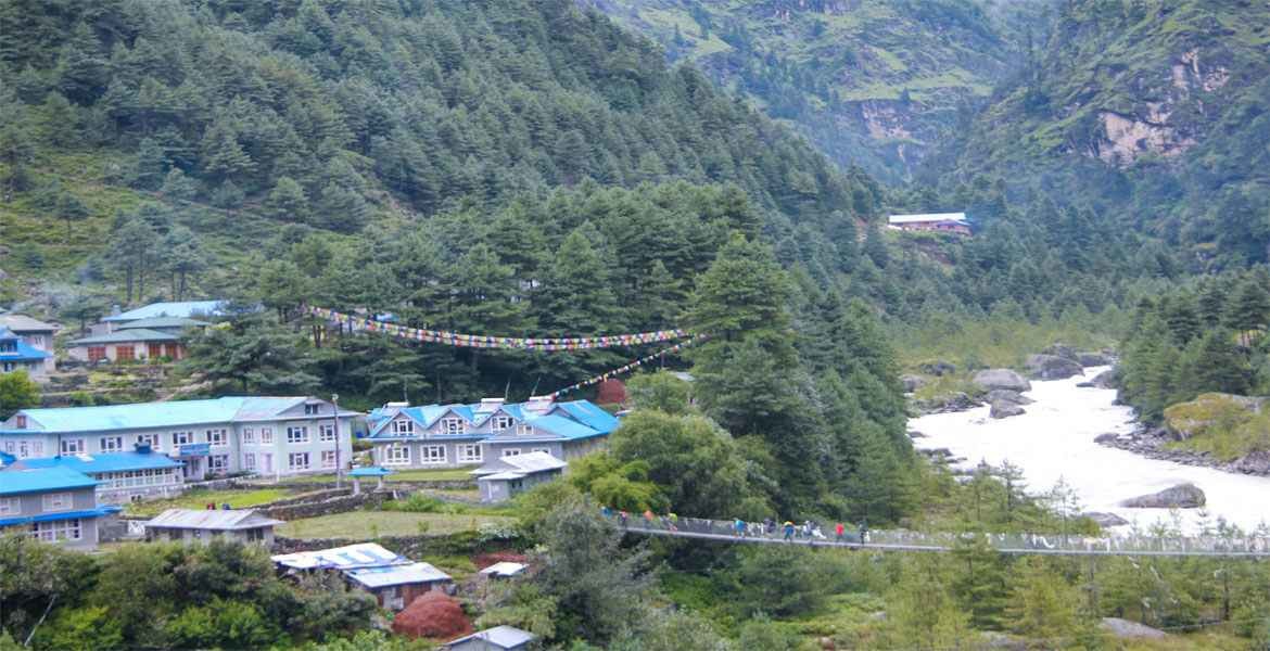 phakding village, suspension bridge and pine trees