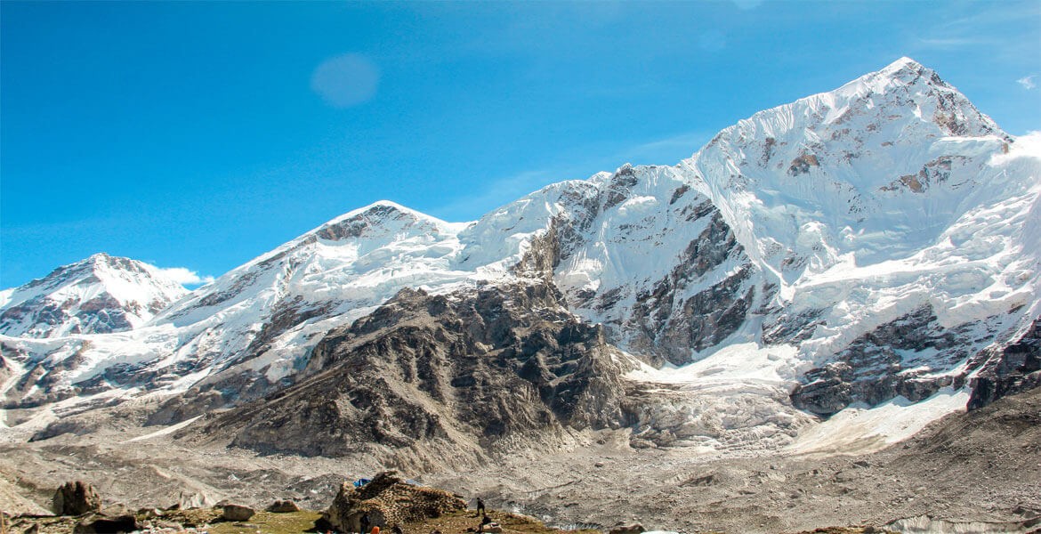 bright mountains with blue skies from the base camp during the everest base cap trek.