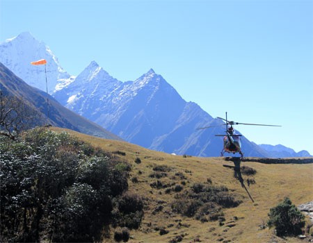 helicopter landing at hotel everest view during the everest base camp landing helicopter tour.